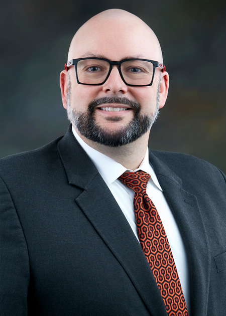 photo portrait of a man in a dark suit