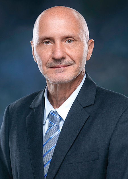 photo portrait of man in a dark blue suit