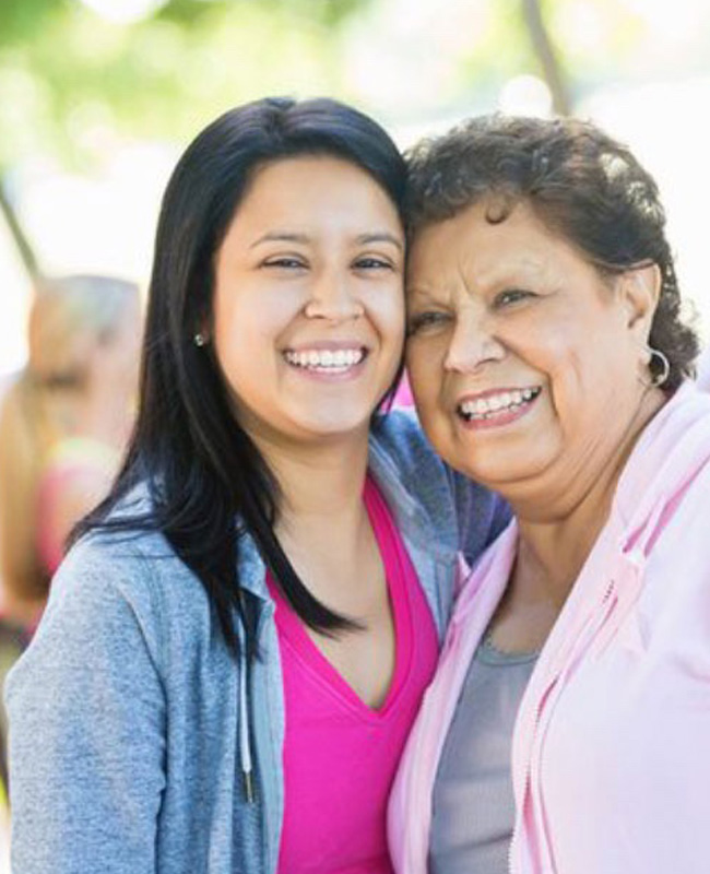 adult daughter and mother embracing