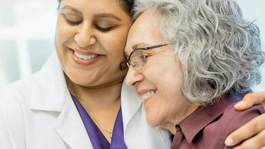 patient and doctor smiling