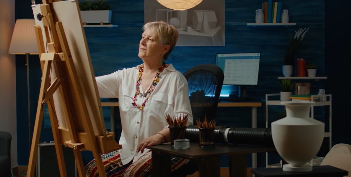 A woman without tremors is able to paint with steady hands.