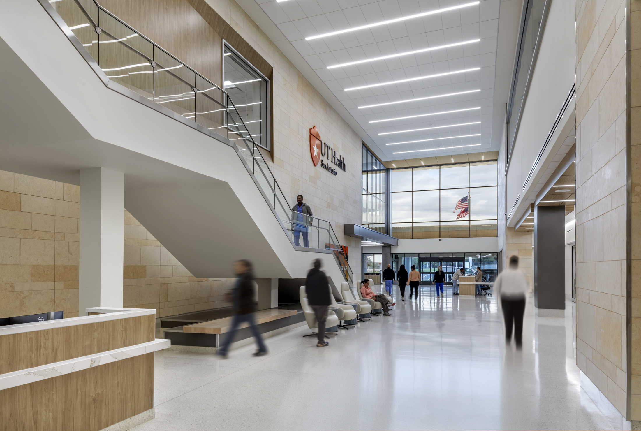 Hospital lobby with patients and visitors moving about
