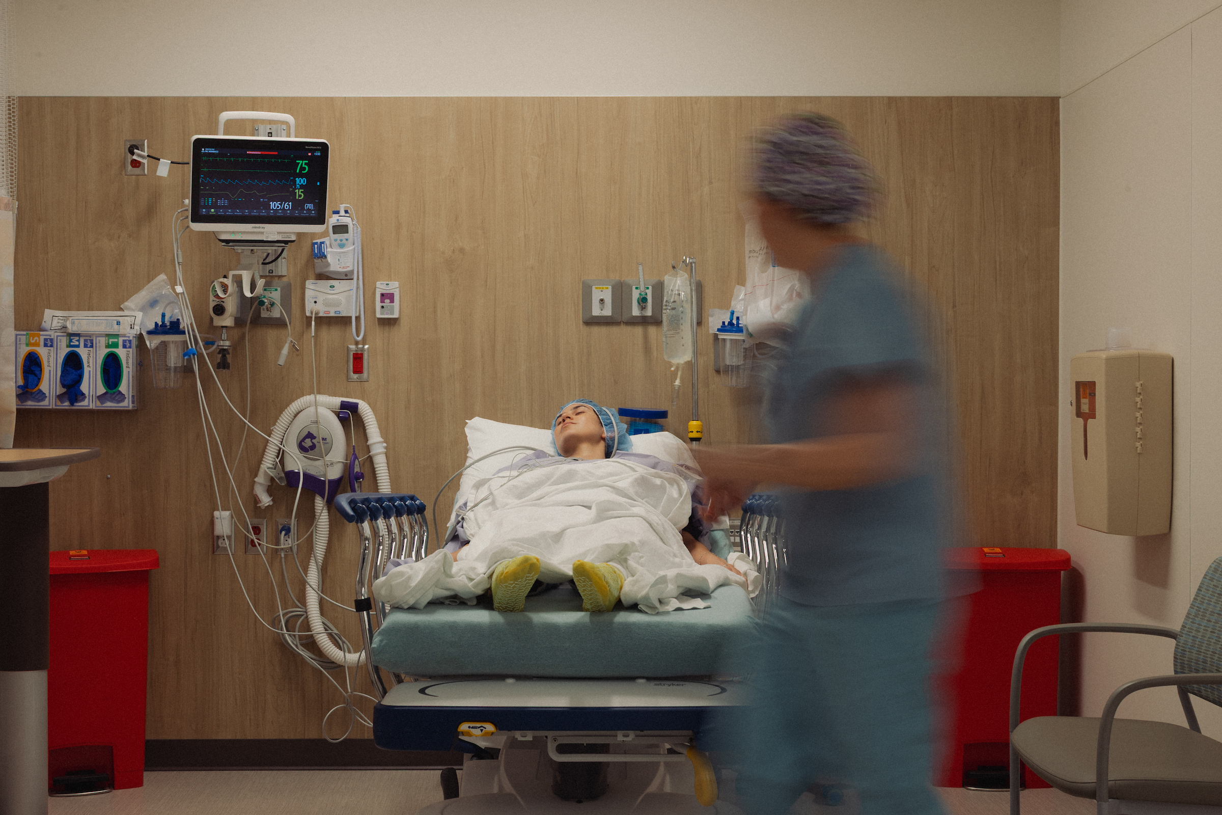 Anesthesiology checks on patient before surgery