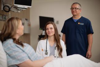 doctor and nurse talk to patient